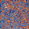 Blue and orange confetti flies in the air.