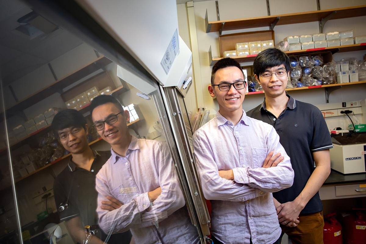 PhD student Yiquan Wang and biochemistry professor Nicholas Wu stand side by side in the Wu Lab.