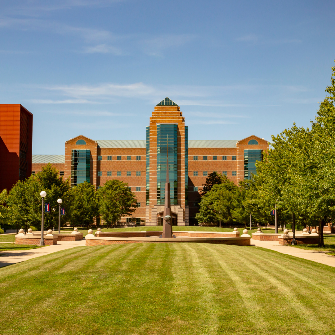 Wide exterior shot of the Beckman Institute on a summer day.