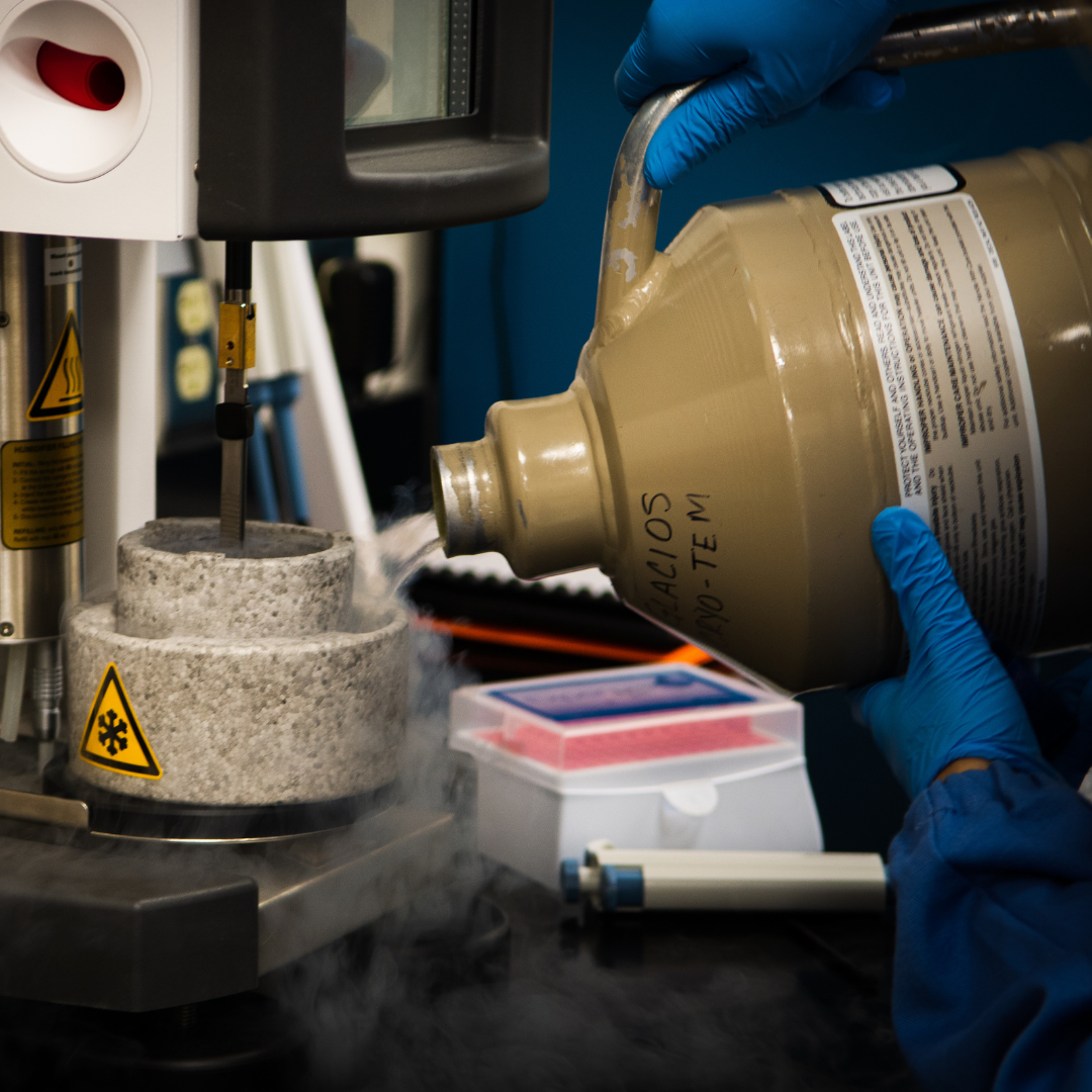 Researcher pours ice to prepare specimens for cryo-EM.