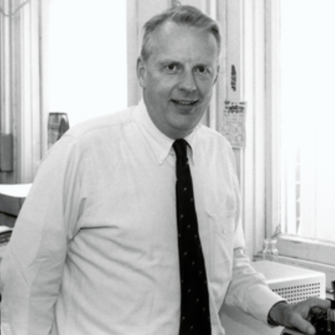 Black and white photo of John Clark in his lab.