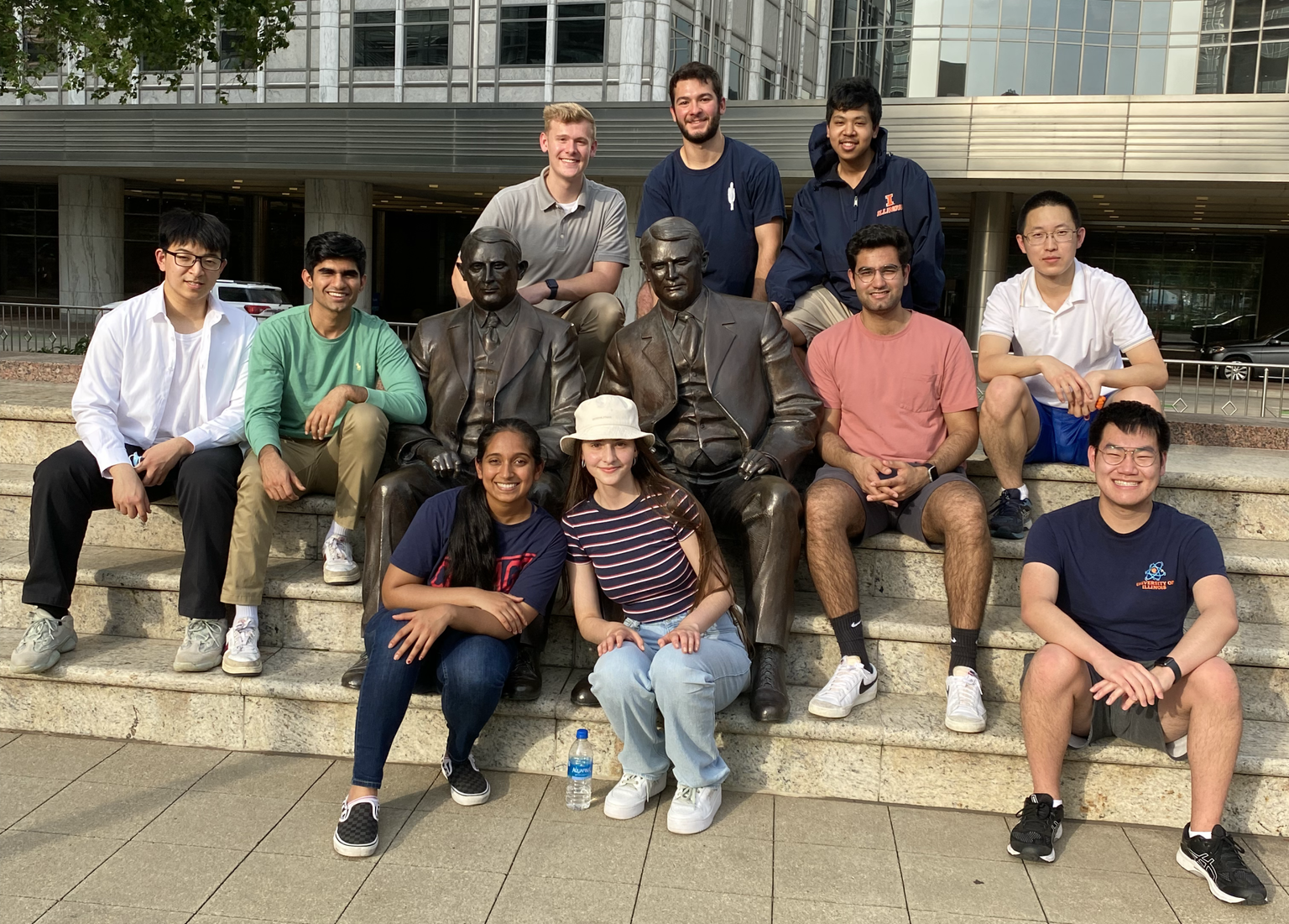 The 2022 Illinois SURF cohort pose around the Mayo Brothers statue outside Mayo Clinic in Rochester, MN