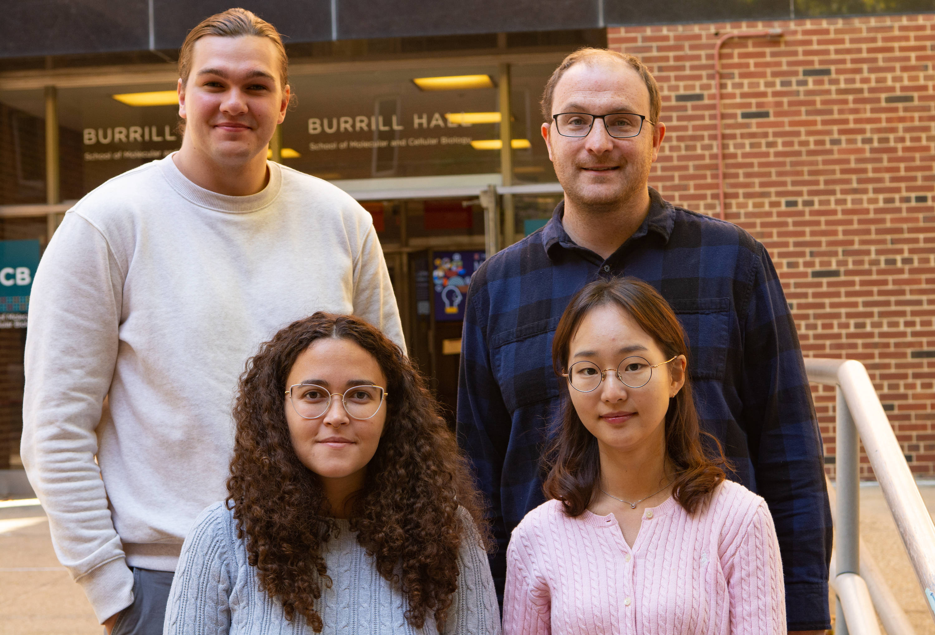 Paper authors stand on the stairs outside Burrill Hall. From left, back row, Jared Butts, Patrick Sweeney, Ingrid Possa, Dajin Cho