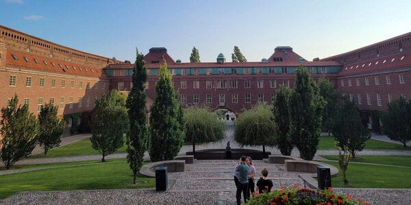 View of KTH campus and garden on sunny day.