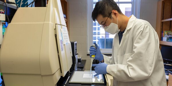 biochemistry student prepares sample