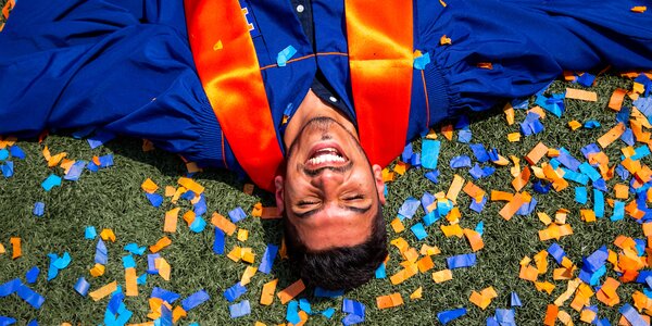 Students celebrate commencement at the University of Illinois Urbana- Champaign during the university-wide ceremony at Memorial Stadium.