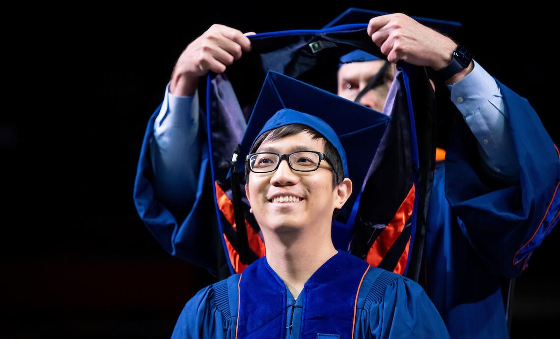 student receives PhD hood