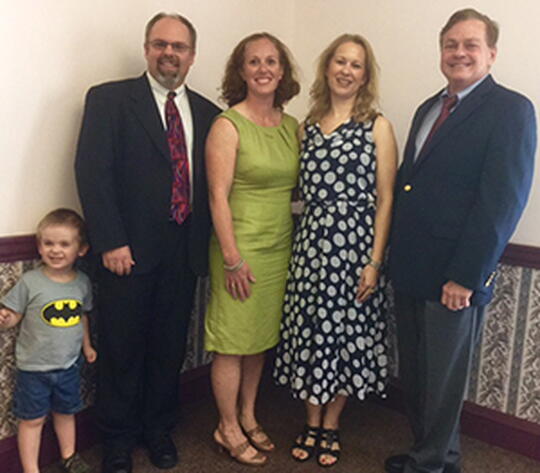 Dr. Tamara Helfer, center, with Brad Mehrtens, Tina Knox, Stephen Sligar, and one of Dr. Helfer’s special deliveries on the left, the mini Mehrtens.