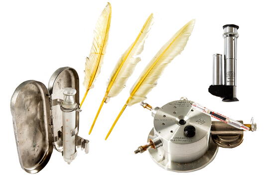 From left, a syringe for transferring precise quantities of algal cells, feathers used to dust glass vessels, an electrometer to measure low light intensities, and a hand-held spectroscope for checking the spectral distribution of light in photosynthesis experiments.