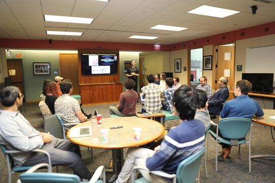 Members of the Tajkhorshid lab gather for a research presentation.