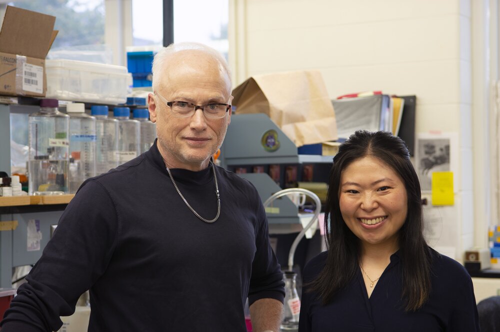 Steven Blanke and Ami Seeger stand in front of a lab bench in Burrill Hall in October 2023.