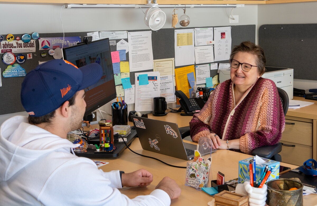academic advisor meets with student in her office