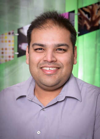 Angad Mehta in the IGB atrium, photo by Fred Zwicky