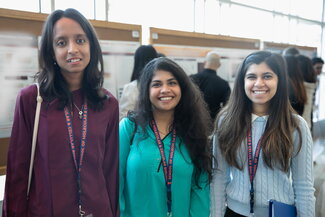 students gather at poster session