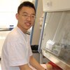 Huaxun Fan, co-author of study, sits in lab.