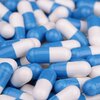 Pill capsules in blue and white