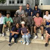 The 2022 Illinois SURF cohort pose around the Mayo Brothers statue outside Mayo Clinic in Rochester, MN