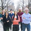 The 2023 cohort of the Beckman Institute Postdoctoral Fellows Program (from left): Kelly Powderly; Patricia Cintora; Zhengchang Kou; Yannan Hu; Zane Thornburg; and Alejandro De la Cadena. They are standing outside in a group with arms folded, smiling for the camera.