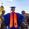 Alma statue wears cap and gown on a spring day.