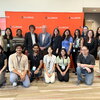 retreat organizers stand in two rows with the keynote speaker and school director