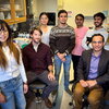 Seven resesarchers gather in Dr. Kevin Van Bortle's cell and developmental biology lab