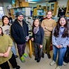 Members of the Hee Jung Chung research group gather around the lab benches