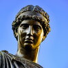Close-up of the learning figure in the Alma Mater statue