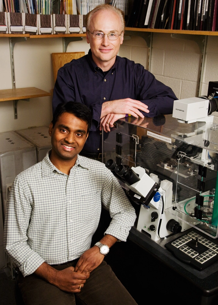 From left, graduate student Vijay Gupta and Steven Blanke, an Illinois professor of microbiology, have discovered how an H. pylori toxin gets into cells. Photo by L. Brian Stauffer