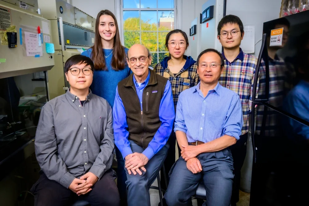 Six researchers gather in a lab