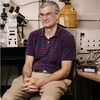 Andrew Belmont sits in lab.