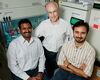 Microbiology professor Steven Blanke (center), graduate student Prashant Jain (left) and postdoctoral researcher Tamilselvam Batcha found that a factor produced by the bacterium H. pylori directly activates an enzyme in host cells that has been associated with several types of cancer, including gastric cancer. Photo by L. Brian Stauffer