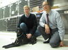 Biochemistry student Quinn Peterson, Professor of Veterinary  Clinical Medicine Tim Fan, and Weasel