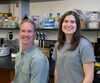 A man and woman standing in front of a lab bench