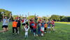 A group of children jumping into the air.