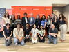 retreat organizers stand in two rows with the keynote speaker and school director
