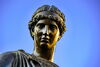 Close-up of the learning figure in the Alma Mater statue
